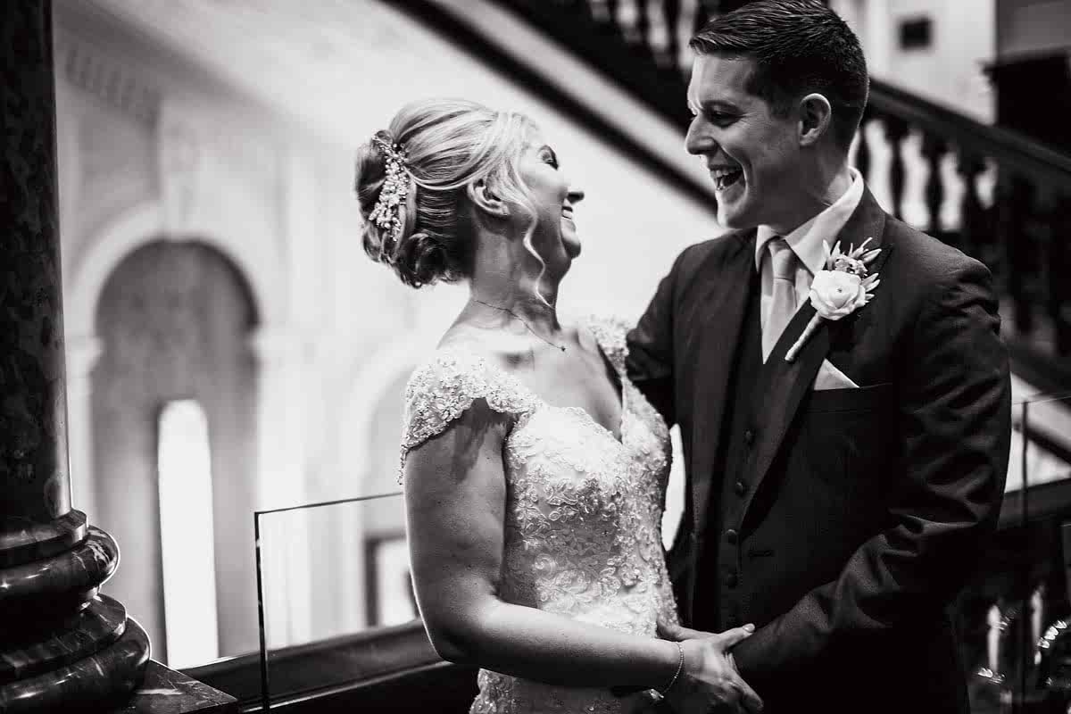bride and groom laughing