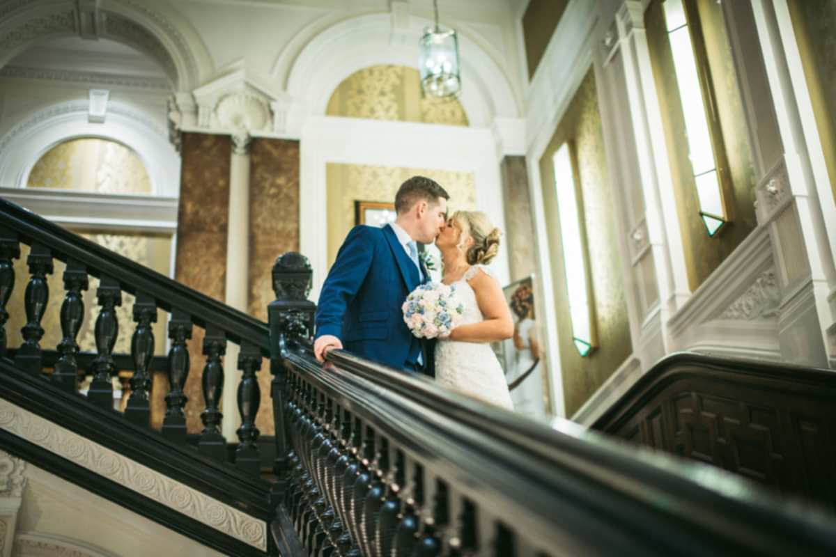 kissing on the staircase at Double Tree Hilton Liverpool 