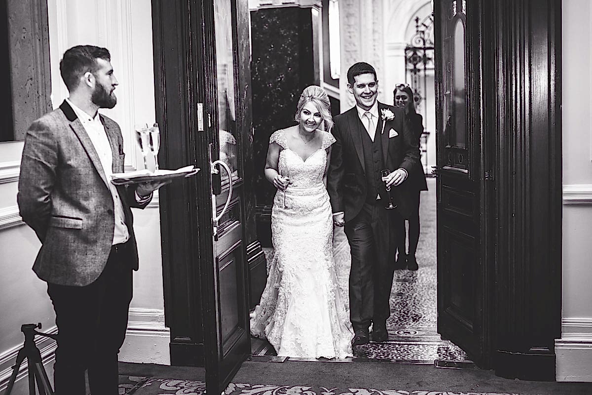 bride and groom entering reception