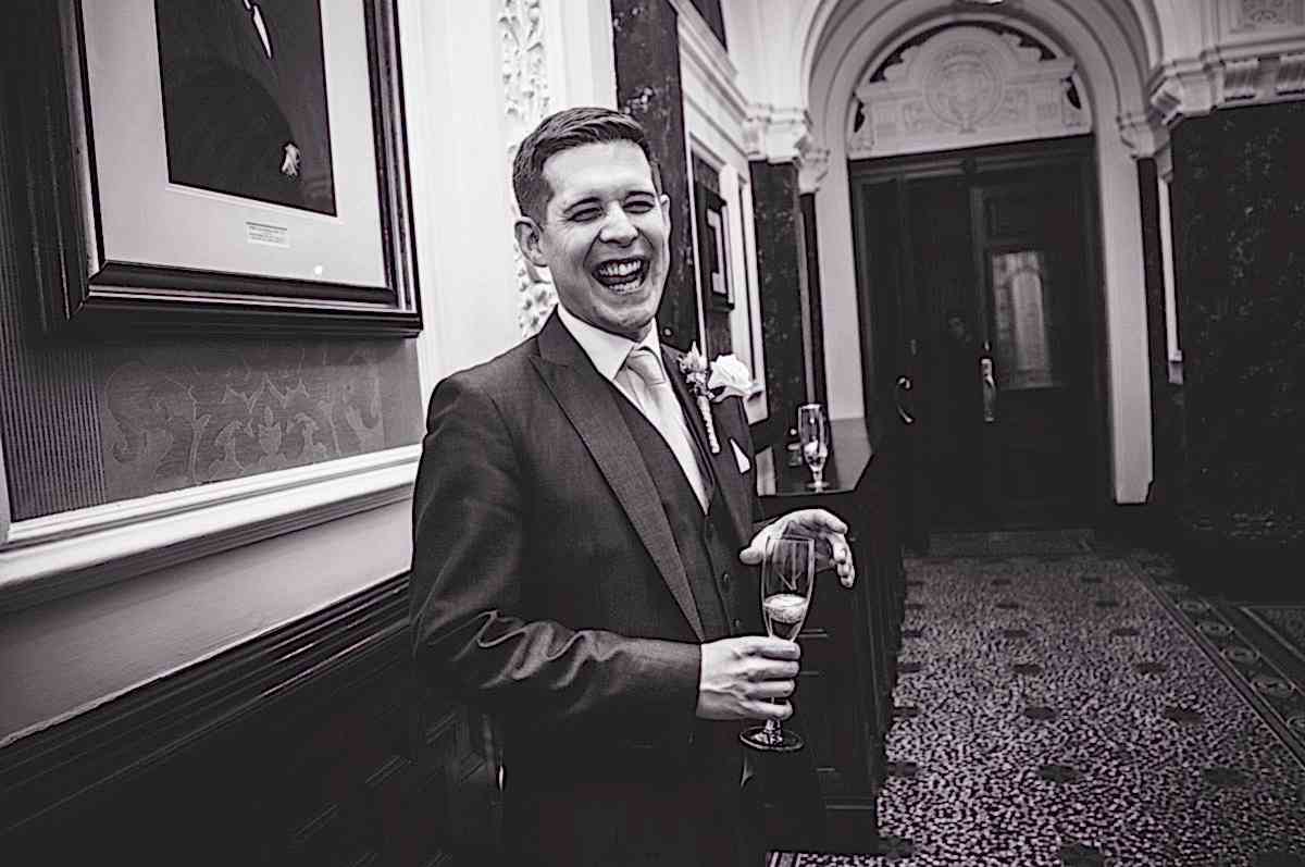 laughing groom