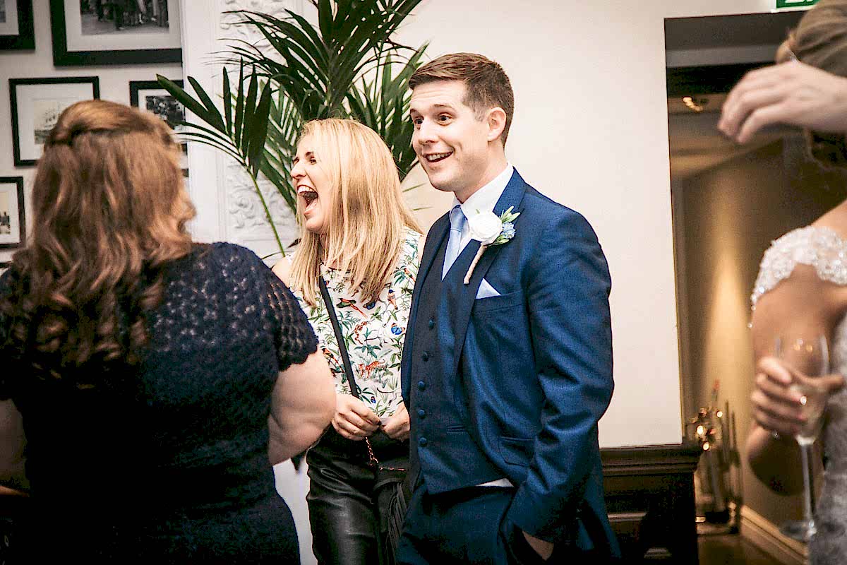shocked groom and laughing guests