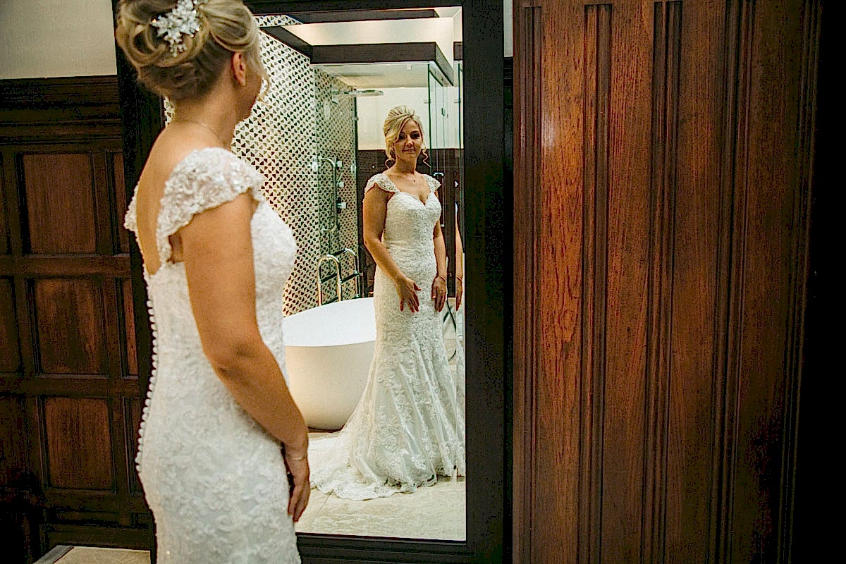 bride looking in the mirror