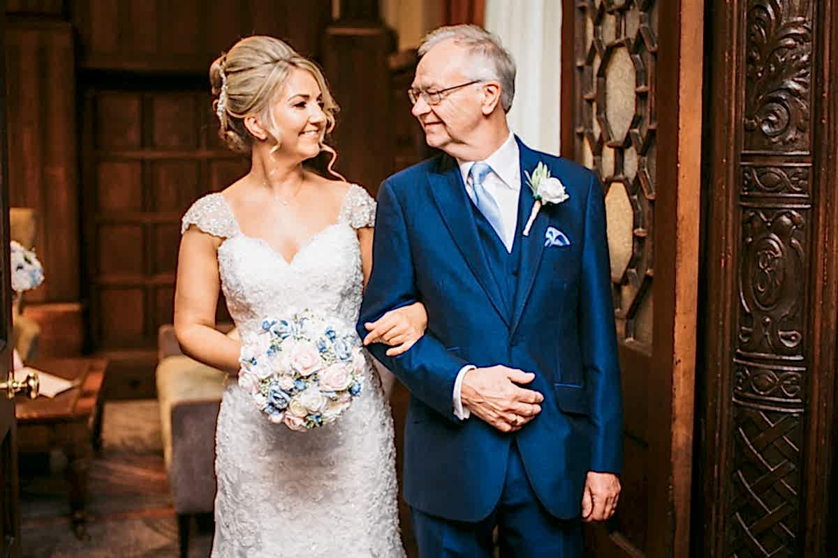 bride smiling at her dad