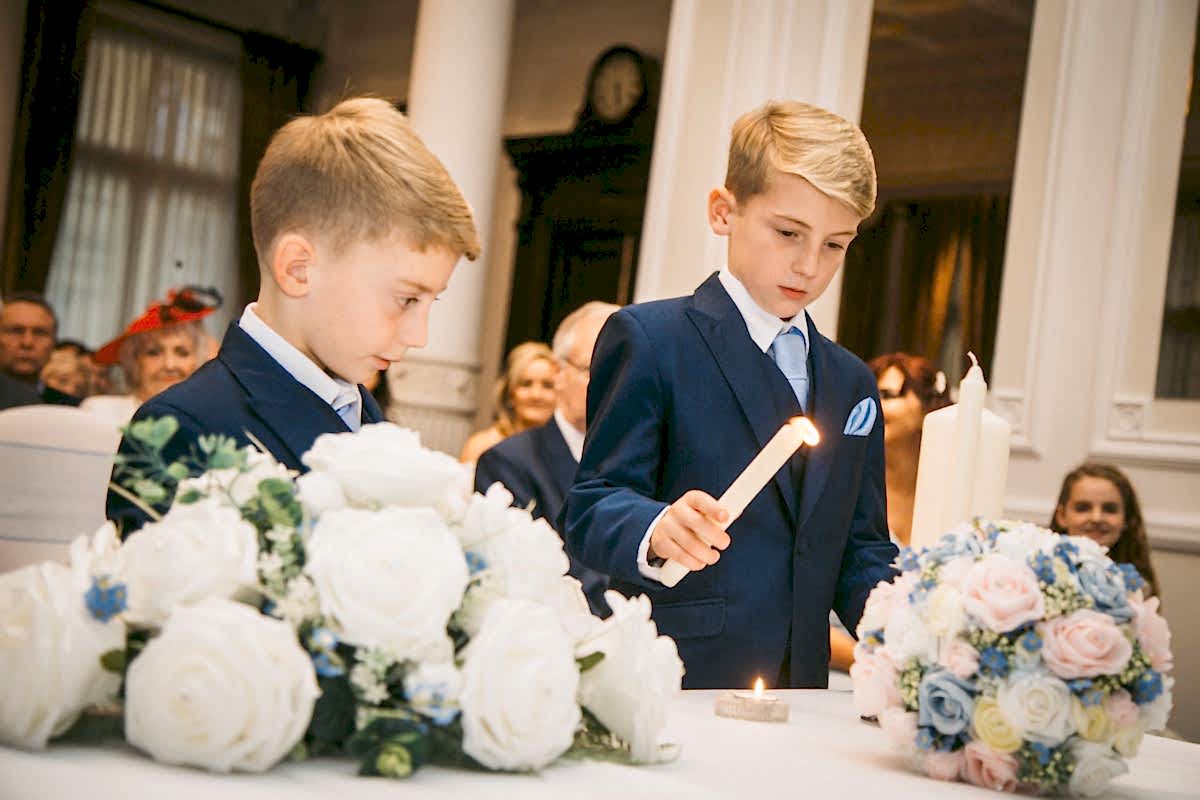 sons lighting candles