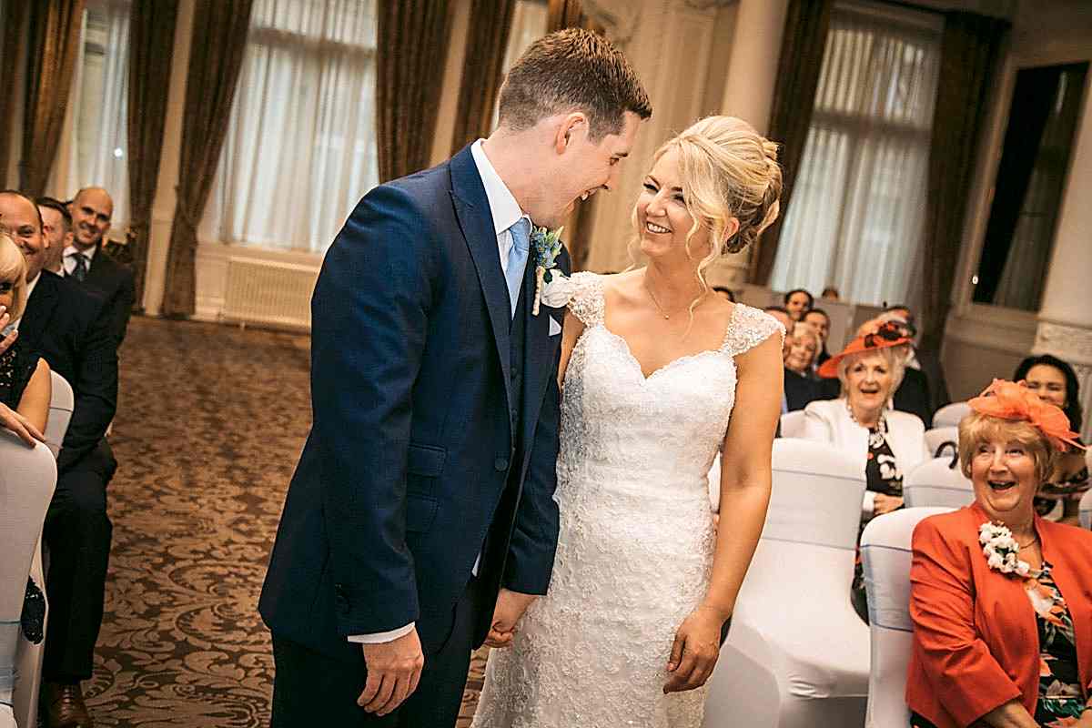 bride and groom laughing