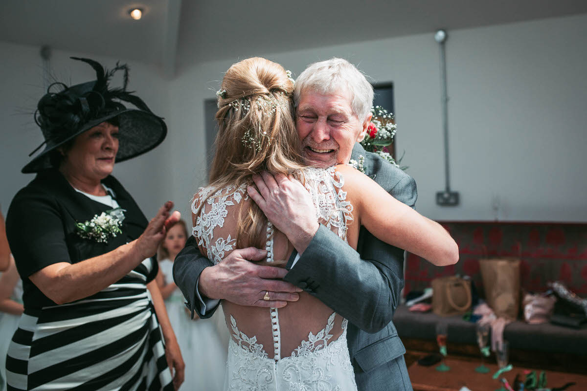 Bride's dad gets emotional when he see's her in her dress