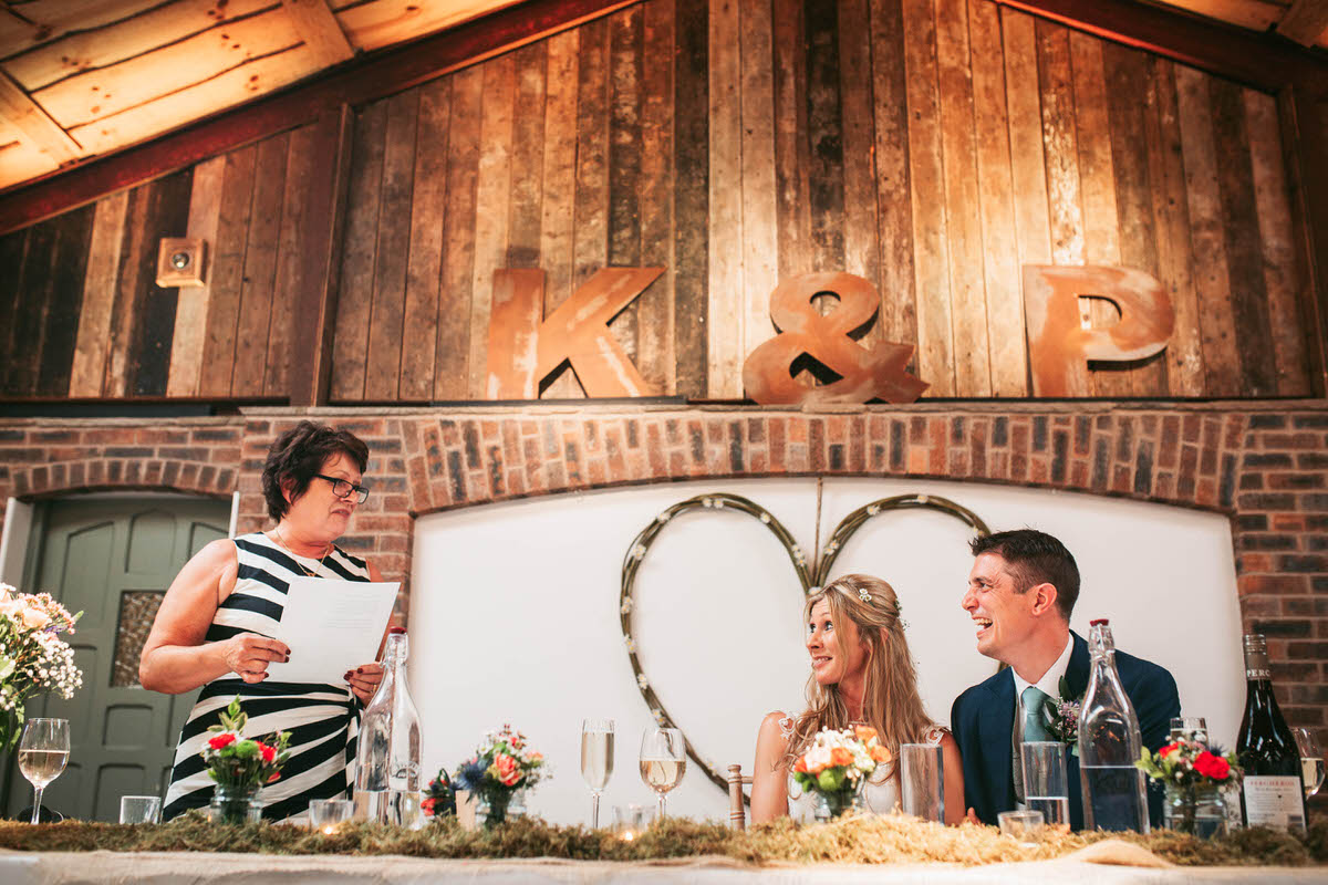 bride's mother reads an amazing poem to the bride and groom at owen house wedding barn