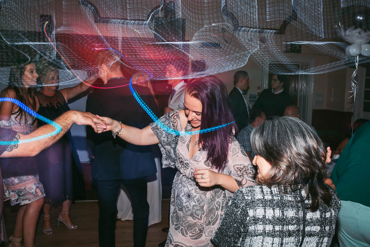 guests dancing with shutter drag effect