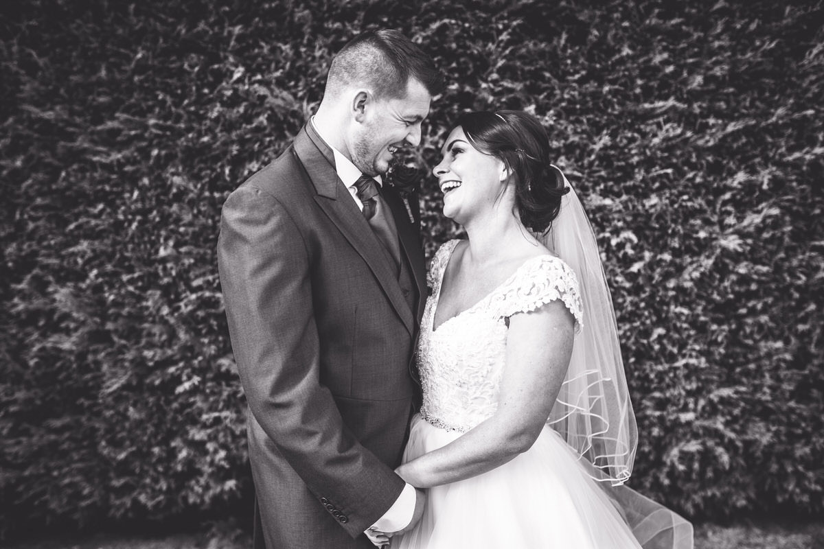 gorgeous photo of couple looking at each other and laughing at beeston manor 