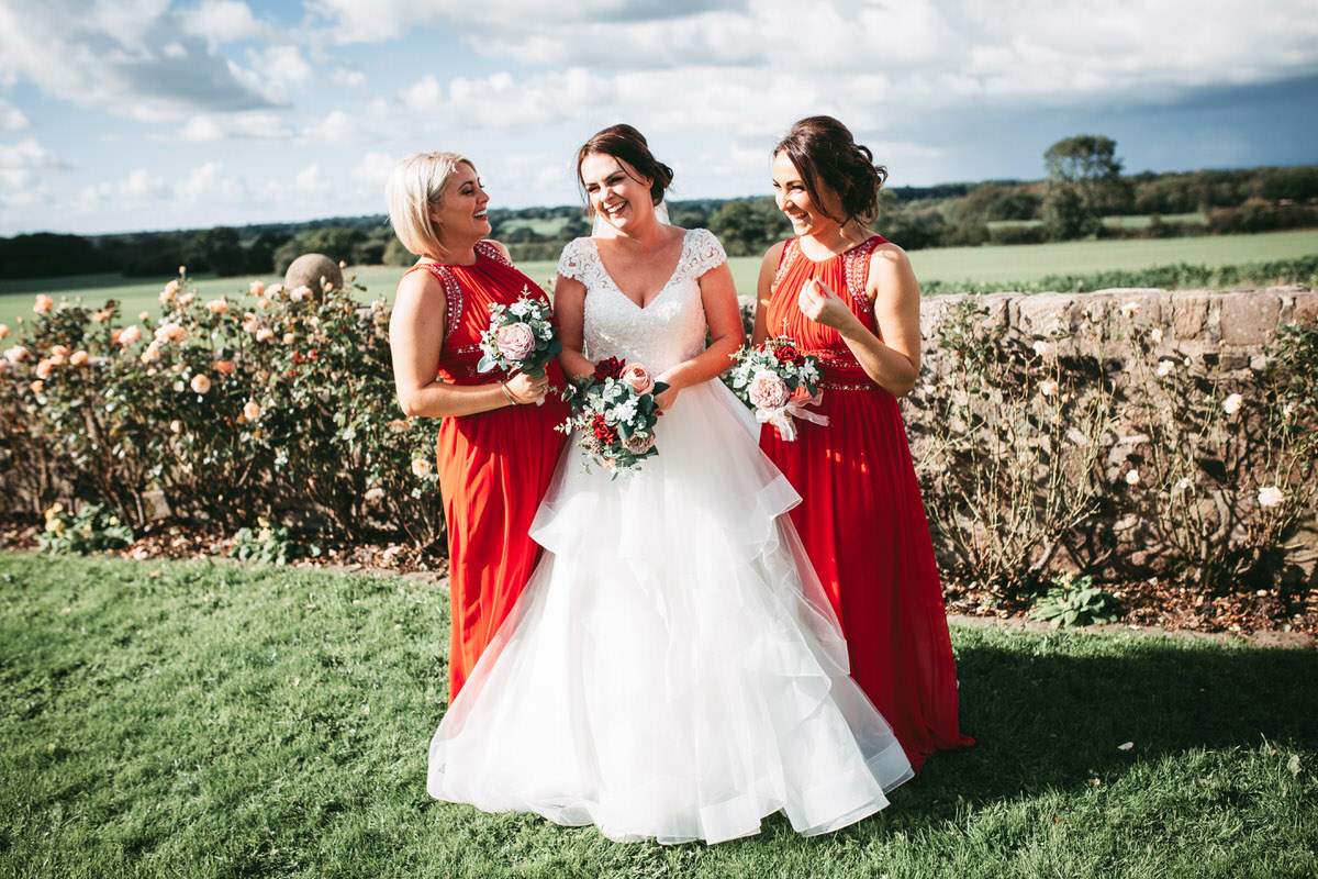 bride laughing with her bridesmaids